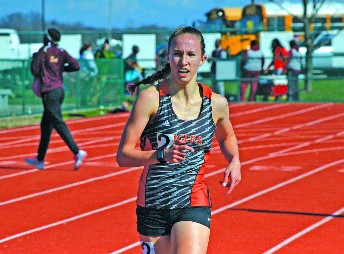 Melissa Spencer runs to a victory in the 1,600-meter run at Belleville West.