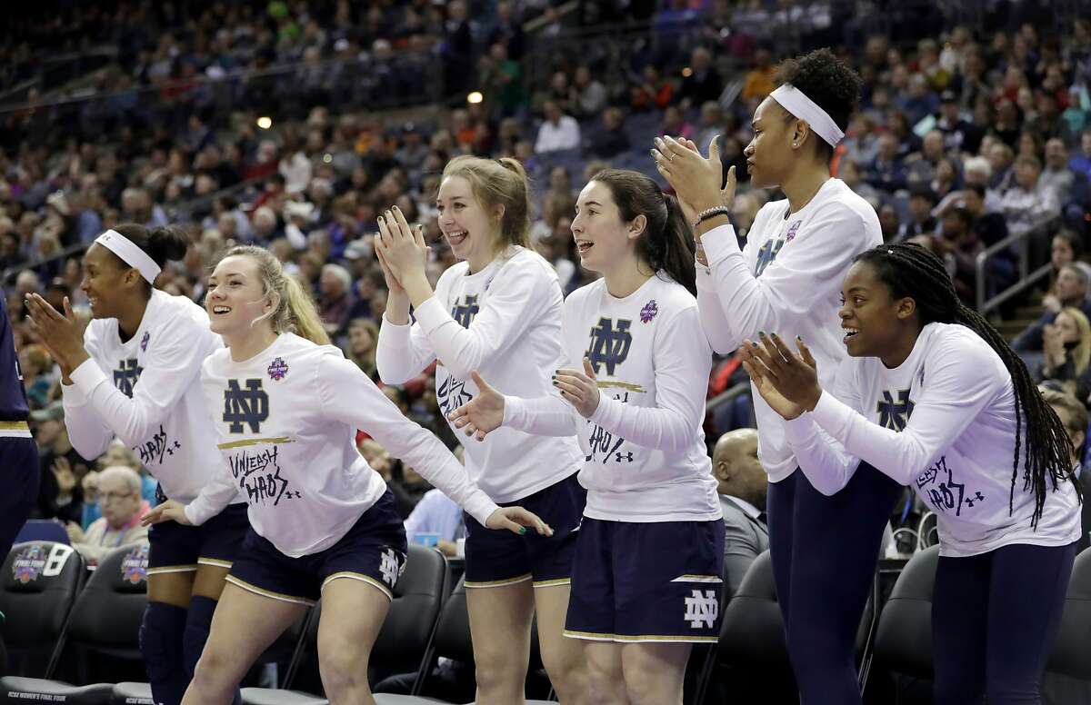 The Notre Dame bench celebrates during the second half against Connecticut in the semifinals of the women's NCAA Final Four college basketball tournament, Friday, March 30, 2018, in Columbus, Ohio. (AP Photo/Tony Dejak)