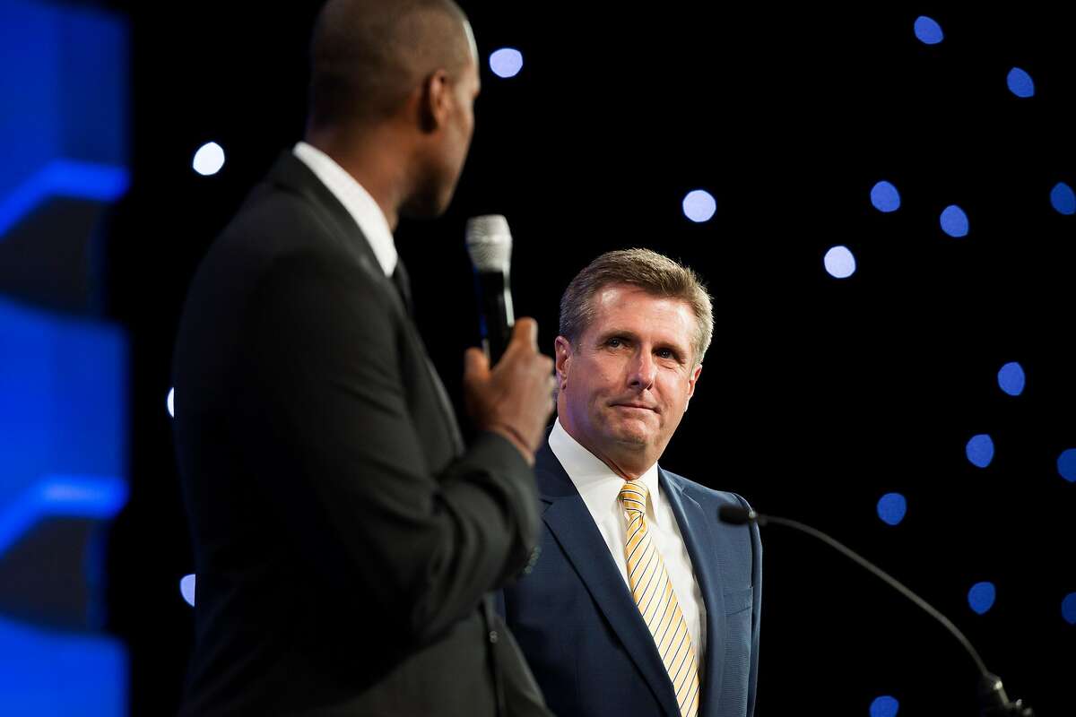 Jarron Collins, Golden State Warriors assistant coach and twin brother of the first out gay NBA player, presents Rick Welts, Golden State Warriors president and CEO, with the Davidson/Valentini Award at the Gay and Lesbian Alliance Against Defamation annual gala at the San Francisco Hilton on September 13, 2014.