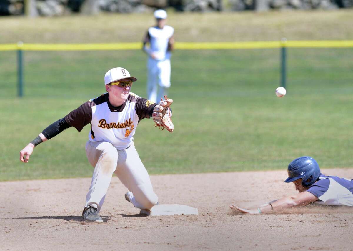 Brunswick second baseman Adan Redahan takes a throw that was just a bit late to get Choate’s Grady Bohen, who stole second on Saturday in Greenwich.