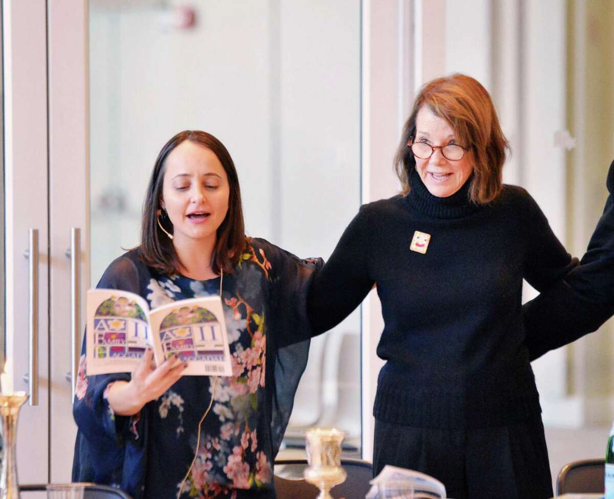 Greenwich Reform Synagogue Rabbi Jordie Gerson, left, and Greenwich Reform Synagogue President Wendy Schreiber, were arm in arm as they led the community seder for Passover at the in the Cos Cob section of Greenwich, Conn., Saturday night, March 31, 2018.