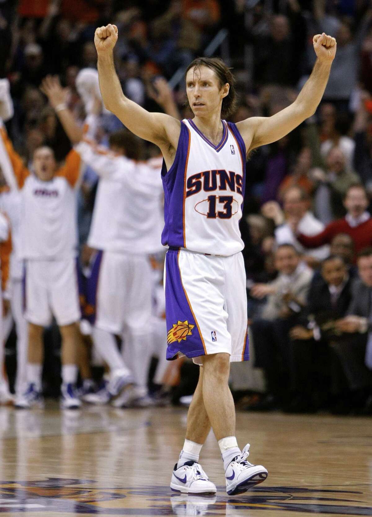 Phoenix Suns' Steve Nash cheers during the second half of the Suns' 118-103 win over the Los Angeles Lakers in an NBA basketball game Monday, Dec. 28, 2009, in Phoenix. (AP Photo/Matt York)