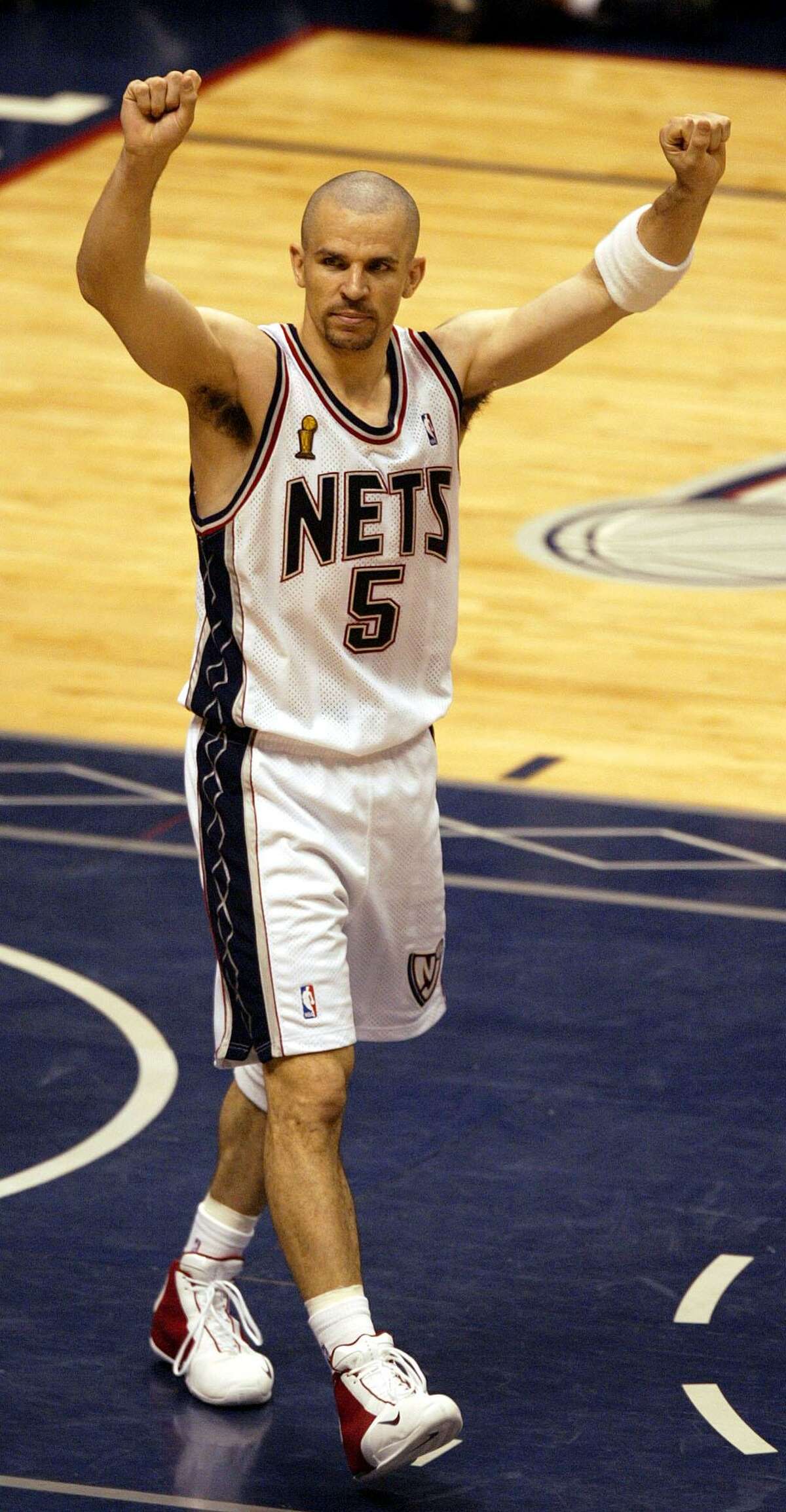 New Jersey Nets' Jason Kidd celebrates the Nets 77-76 win over the San Antonio Spurs' during Game 4 of the NBA Finals Wednesday, June 11, 2003 in East Rutherford, NJ. (AP Photo/Miles Kennedy)