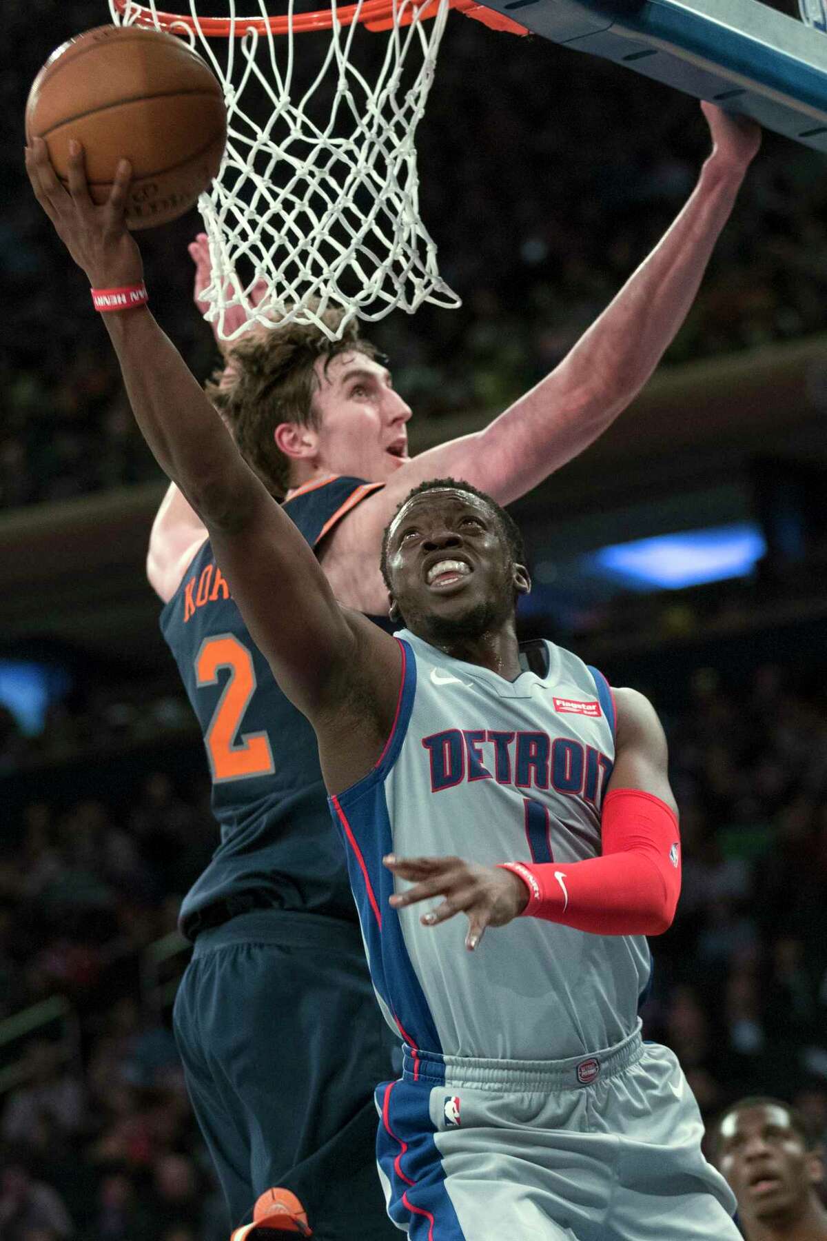 Detroit Pistons guard Reggie Jackson (1) goes to the basket past New York Knicks forward Luke Kornet (2) during the first half of an NBA basketball game Saturday, March 31, 2018, at Madison Square Garden in New York. (AP Photo/Mary Altaffer)