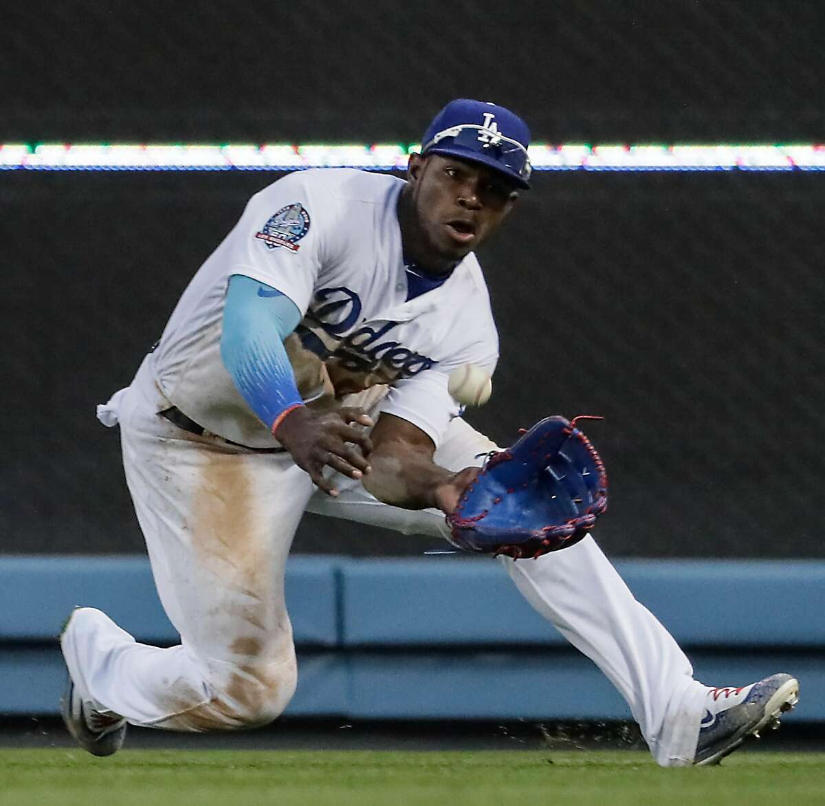 Los Angeles Dodgers right fielder Yasiel Puig makes a sliding catch of a long drive from San Francisco Giants first baseman Brandon Belt to end a sixth inning scoring threat on Sunday, April 1, 2018 at Dodger Stadium in Los Angeles, Calif. (Robert Gauthier/Los Angeles Times/TNS)