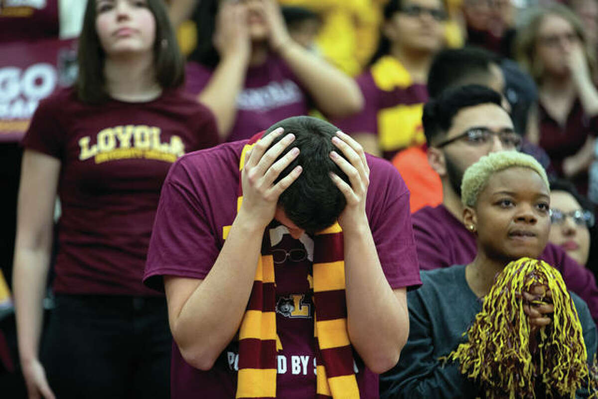 Fans watch the Loyola-Chicago versus Michigan NCAA Final Four game at the March Madness watch party Saturday, in Chicago.