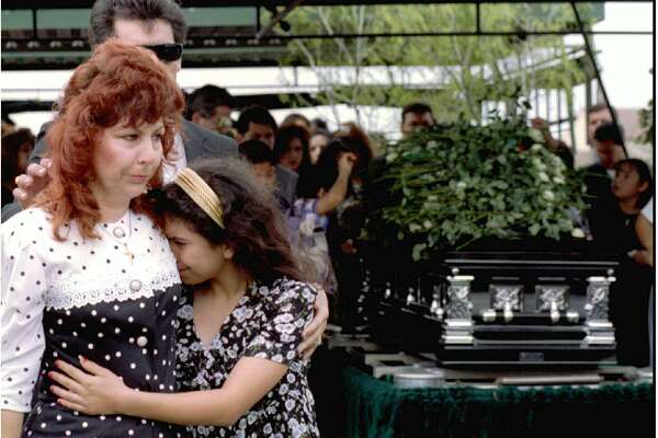 Rose and Heidi Arredondo walk past the casket of Selena Quintanilla-Perez d...