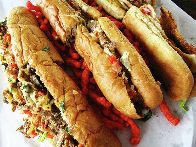 From left, Philly cheesesteak, Italian steak and smoke stack sandwiches from Gino's Deli at Stop N Buy in San Antonio.