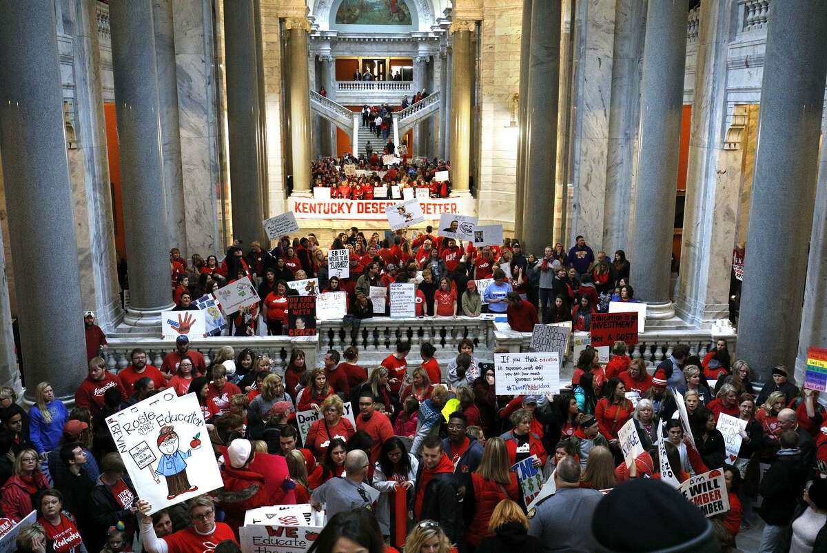 Public school teachers and their supporters gather outside the Senate chambers at the Kentucky state Capitol in Frankfort.