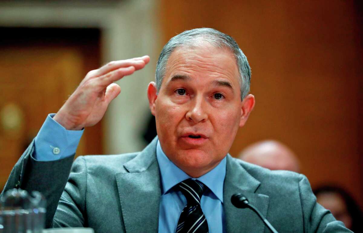 FILE - In this Jan. 30, 2018, file photo, Environmental Protection Agency administrator Scott Pruitt testifies before the Senate Environment Committee on Capitol Hill in Washington. Environmental regulators announced on Monday, April 2, 2018, they will ease emissions standards for cars and trucks, saying that a timeline put in place by President Obama was not appropriate and set standards ?“too high.?” Pruitt says the agency will work with all states, including California, to finalize new standards. (AP Photo/Pablo Martinez Monsivais, File)