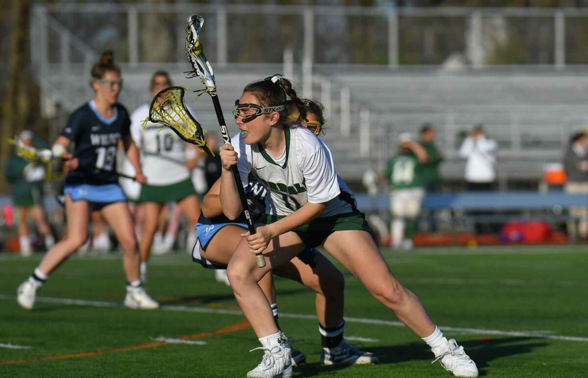 Norwalk’s Lily L’Archevesque works against a Wilton defender in this April 18, 2017 file photo.