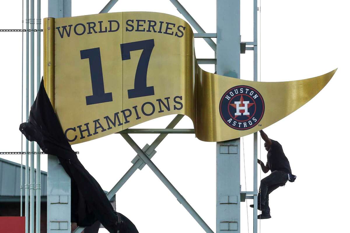 The World Series championship banner is unveiled during pregame ceremonies at the Astros home opener at Minute Maid Park on Monday, April 2, 2018, in Houston.