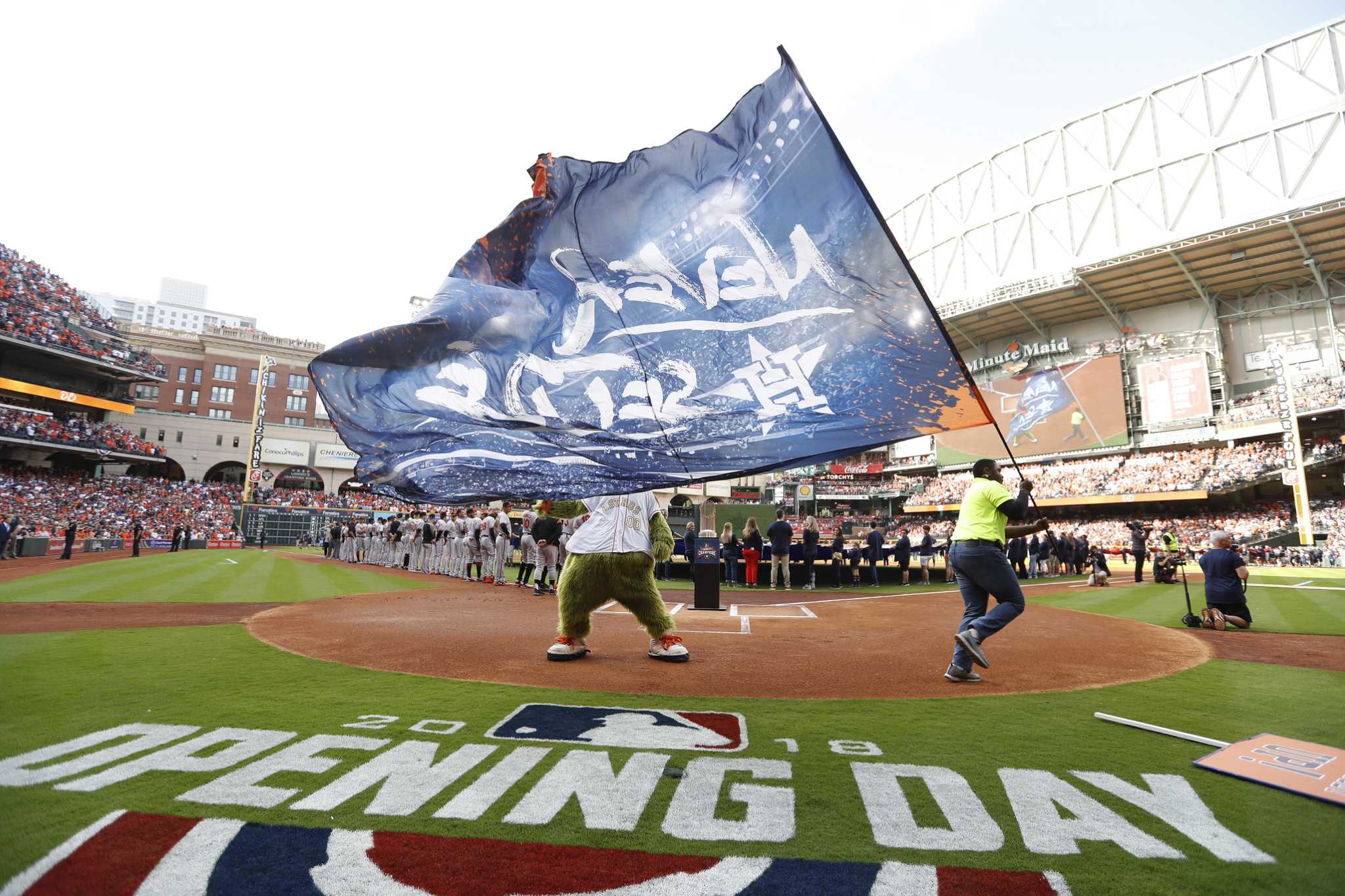 Houston, United States. 26th Oct, 2021. A large American flag is unfurled  on the field before the start of game one of the MLB World Series between  the Houston Astros and the