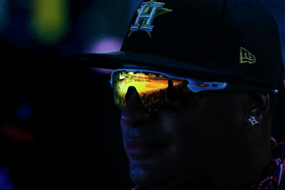 Minute Maid Park reflects in Ruben Cardenas' sunglasses. "I love the Astros," he said. "Ever since I started watching TV, I've been watching the Astros." Photo: Michael Ciaglo / Michael Ciaglo
