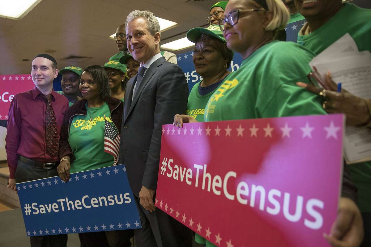 New York Attorney General Attorney General Eric Schneiderman poses for a photo with members of District Council 37 after a news conference, Tuesday, April 3, 2018, in New York. Schneiderman announced a new lawsuit by seventeen states, the District of Columbia and six cities against the U.S. government Tuesday, saying a plan to add a citizenship demand to the census questionnaire is unconstitutional. (AP Photo/Mary Altaffer)