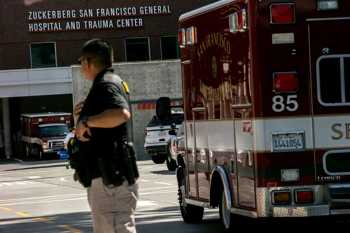 San Francisco Sheriff's official guards outside Zuckerberg General Hospital and Trauma Center, Tuesday, April 3, 2018, in San Francisco, Calif. Police responded to a report of an active shooter at YouTube headquarters in the city of San Bruno. Three of the victims have been transported to General Hospital.