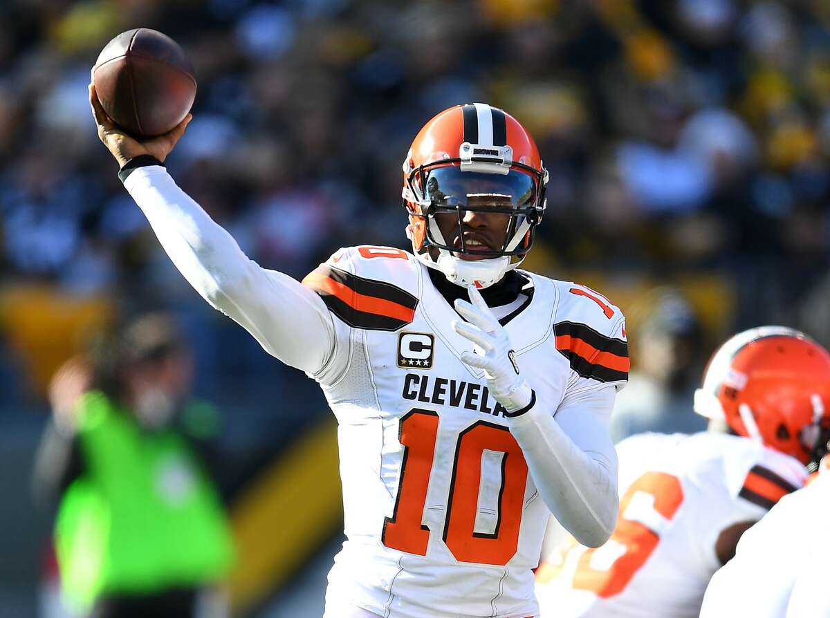 Baltimore Ravens quarterback Robert Griffin III (3) throws before an NFL  football game against …