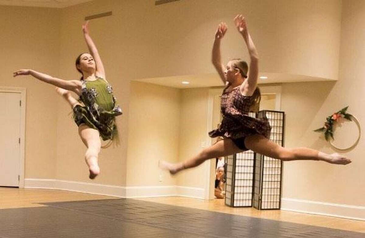 Studio D in New Milford held its annual “Winter Showcase.” Above, Gabriela Esposito and Elizabeth Hawley loft for perfection during a dance piece.