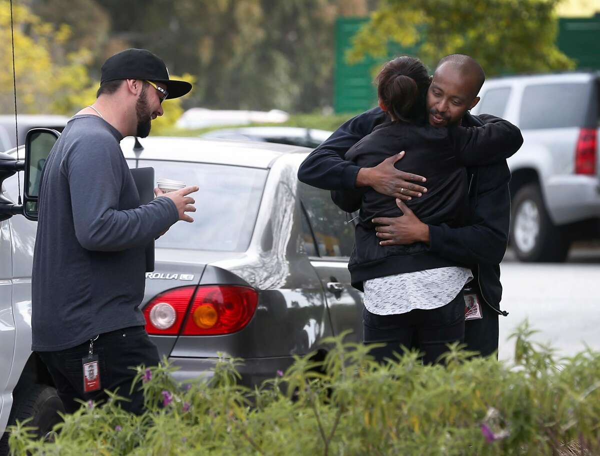 Unidentified employees hug outside of YouTube headquarters in San Bruno, Calif. on Wednesday, April 4, 2018. On Tuesday, disgruntled video maker Nasim Aghdam shot and wounded three YouTube employees before turning the gun on herself.