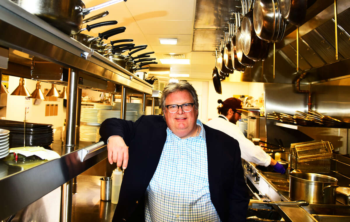 Celebrity chef David Burke, the new culinary director of the Saratoga Springs-based Adelphi Hospitality Group, poses in the kitchen of the company's Adelphi Hotel in downtown Saratoga. Burke, associated with many top restaurants in New York City and elsewhere over the past 30 years, will supervise food service in the hotel's restaurant, called The Blue Hen; its bar, Morrissey's Lounge; catering operations; and the company's next-door steakhouse, Salt & Char. New menus are being introduced this week. (Photo by Steve Barnes/Times Union.)