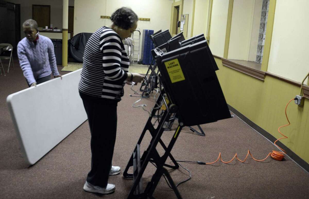 Voters at the polls in Pittsburgh in 2014. Pennsylvania could be a key battleground state in the 2016 presidential election, but the commonwealth still employs 1980s-era voting machines that could be vulnerable to hacking.