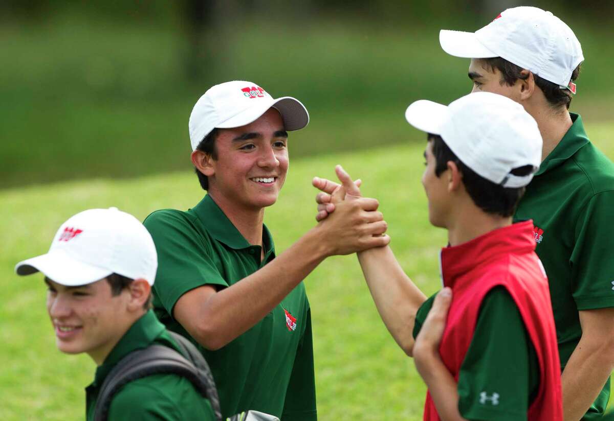 JP Lavalle of The Woodlands celebrates with teammates after finishing -4 under par win the individual title during the final round of the District 12-6A golf tournament at High Meadow Ranch, Wednesday, April 4, 2018, in Magnolia.