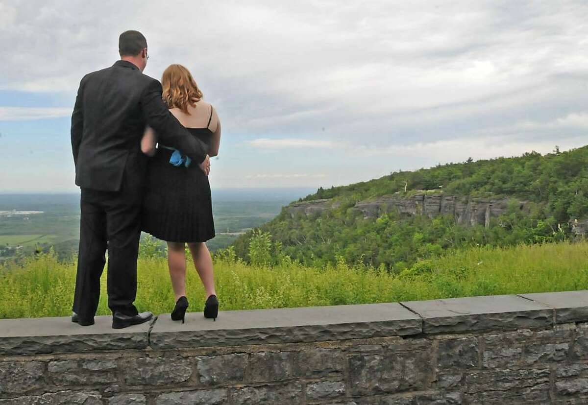 Matthew Brink, 25, and Michelle Curtis, 17, take in the view at Cliff Edge Overlook at John Boyd Thacher Park in New Scotland. The couple said they were planning to attend the Berne-Knox-Westerlo junior prom in the evening. (Lori Van Buren / Times Union)