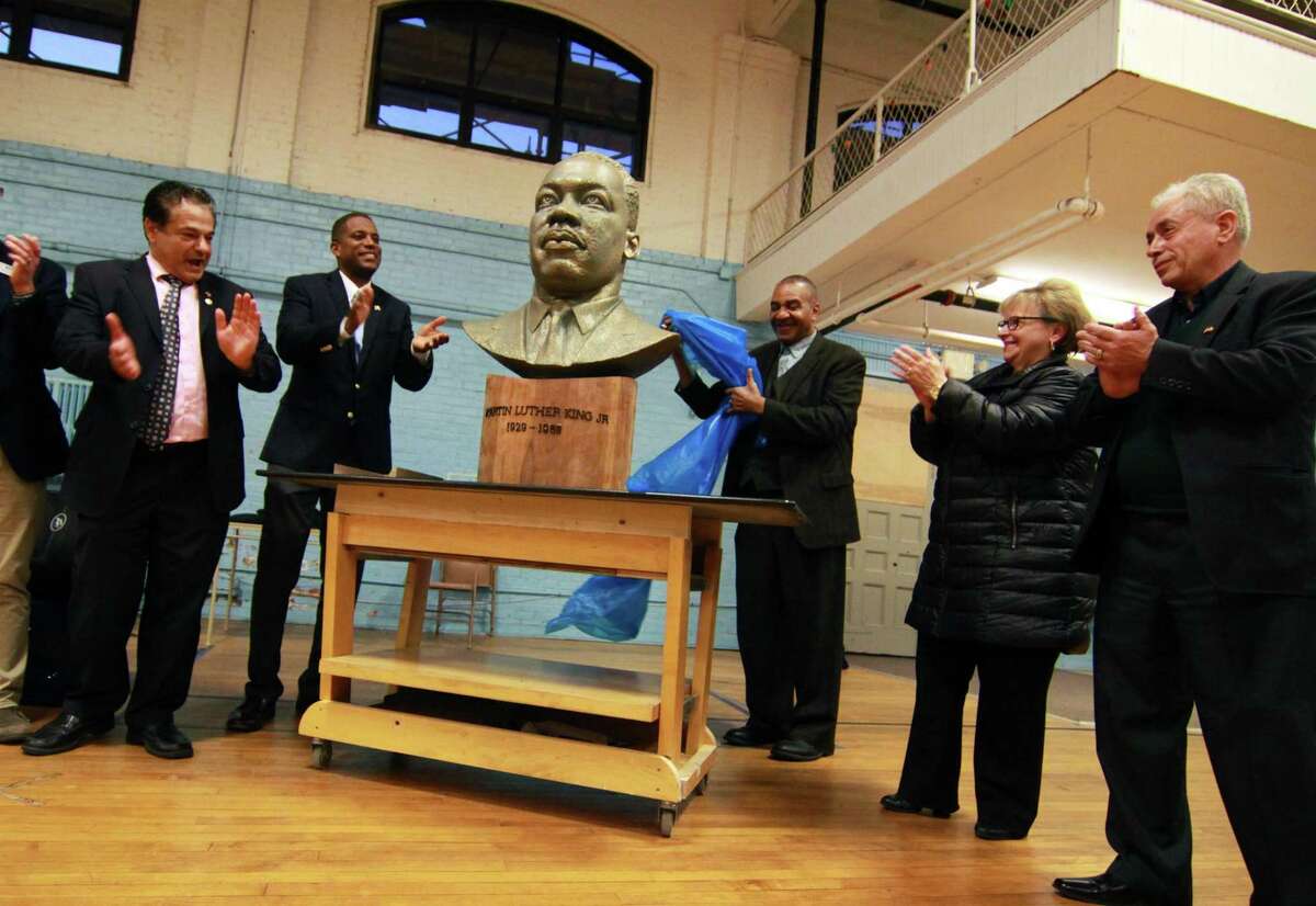 On the 50th anniversary of the assassination of Martin Luther King, Jr., a bust of him was unveiled during a ceremony at the Ansonia Armory in Ansonia, Conn., on Wednesday Apr. 4, 2018. The bust was created by Ansonia resident Vasil Rakaj, standing at right. From left to right is Ansonia Mayor David Cassetti, State Sen. George Logan, Rev. Alfred Smith, State Rep. Linda Gentile and Mr. Rakaj.