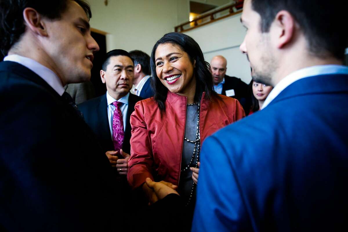Acting Mayor London Breed (center) chats with guests at Congresswoman Nancy Pelosi's annual New Years celebration at the Golden Gate Club in San Francisco, California, on Sunday, Jan. 14, 2018.