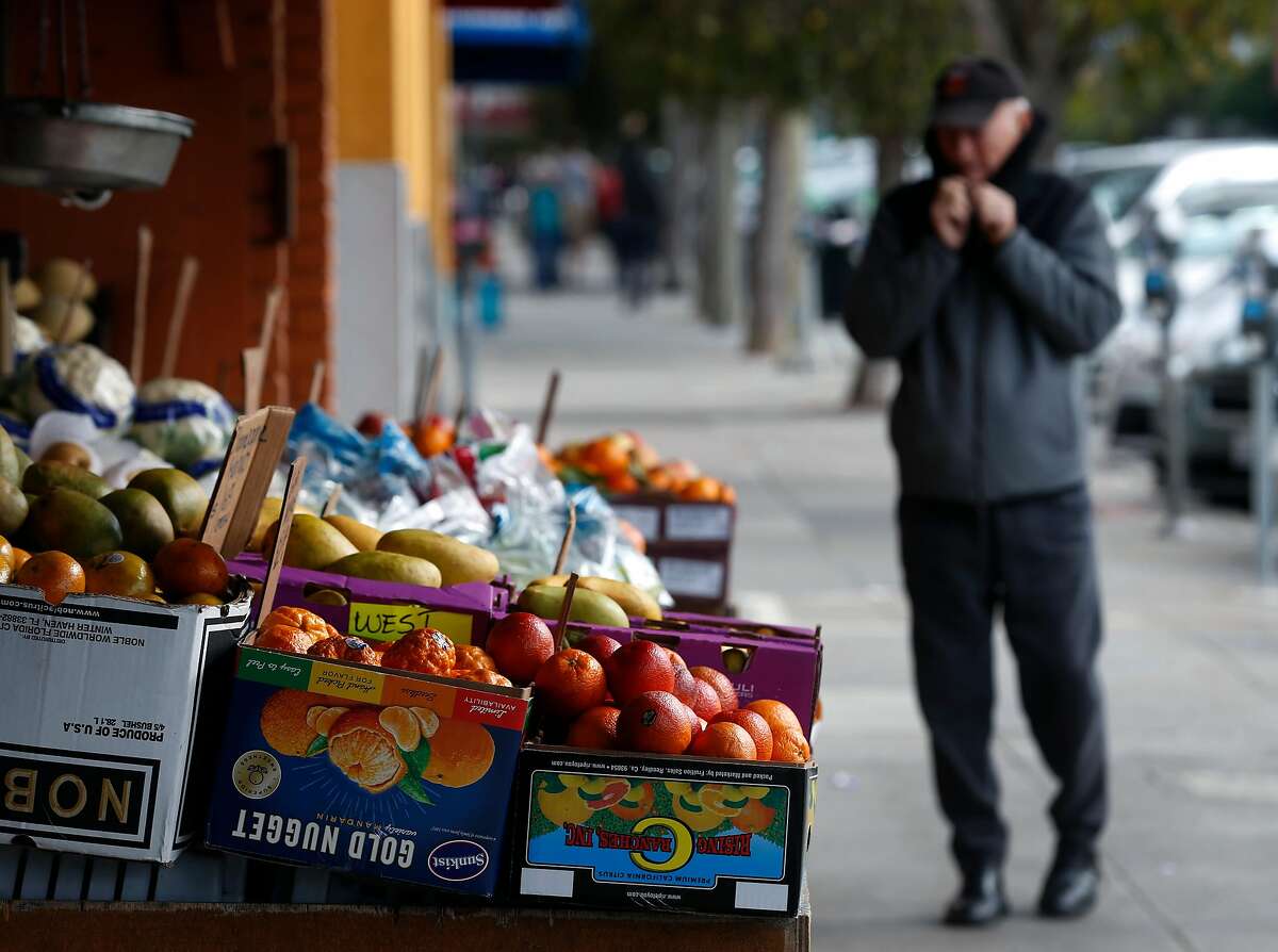 Produce is displayed on the sidewalk at a market on West Portal Avenue in San Francisco, Calif. on Thursday, April 5, 2018. Supervisor and mayoral candidate Jane Kim is opposing SB827, authored by state Sen. Scott Wiener, which would require cities to allow four- to eight-story apartment and condo buildings in residential areas if they are within a half mile of major transit hubs and would also mandate that cities allow such buildings within a quarter mile of highly used bus and light-rail stops.