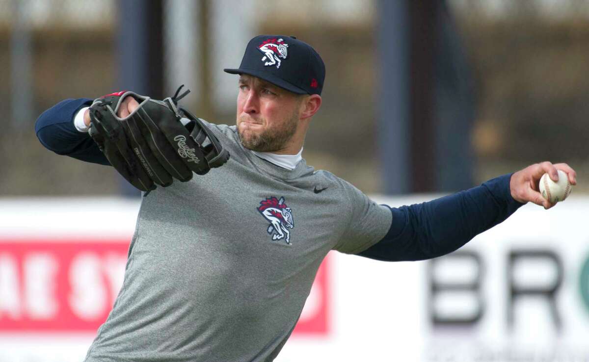 New York Mets outfielder Tim Tebow warms up before his debut with the Binghamton Rumble Ponies minor league baseball team as they host the Portland Sea Dogs, Thursday, April 5, 2018, at NYSEG Stadium in Binghamton, N.Y.
