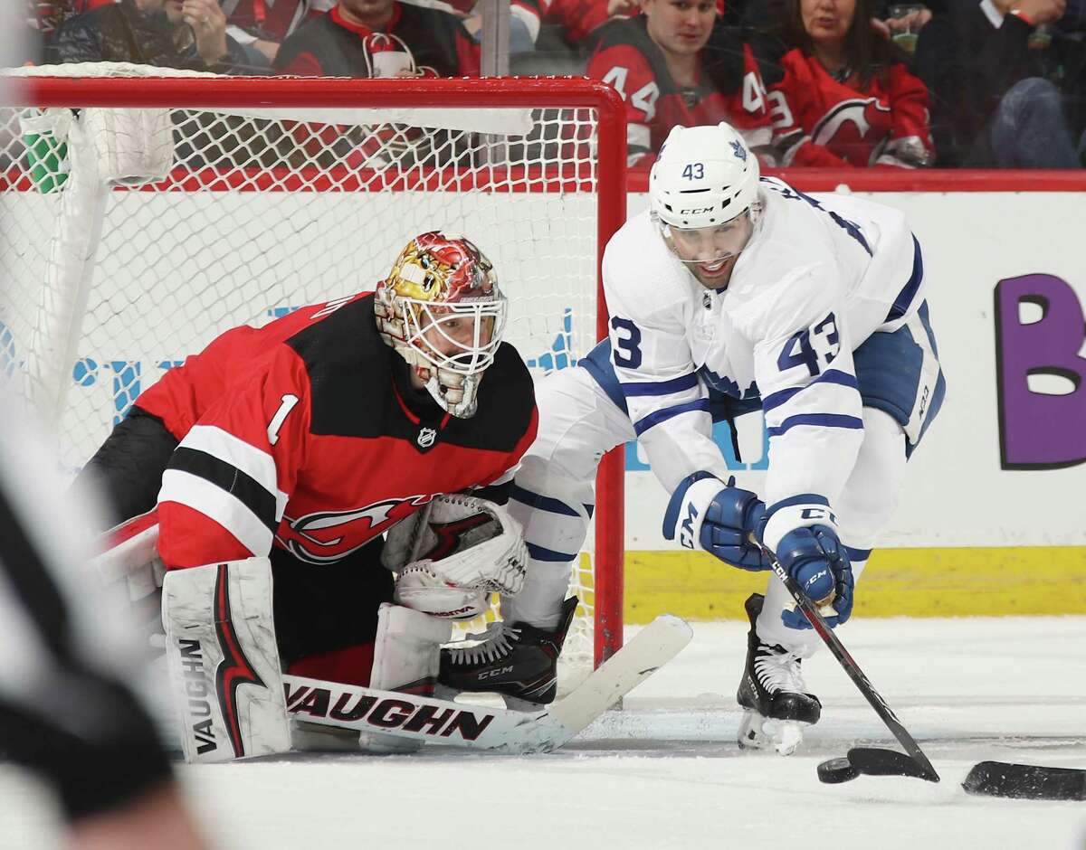 NEWARK, NJ - APRIL 05: Nazem Kadri #43 of the Toronto Maple Leafs tries to control the puck in front of Keith Kinkaid #1 of the New Jersey Devils during the second period at the Prudential Center on April 5, 2018 in Newark, New Jersey. (Photo by Bruce Bennett/Getty Images)