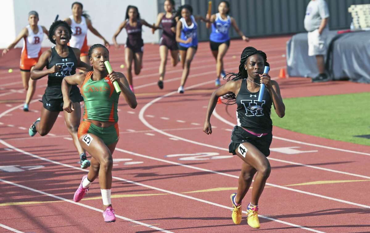 Harlan's Jasmine Henry anchors the winning 4X10 metter relay team during the District 28-5A track and field meet at Alamo Stadium on April 5, 2018.