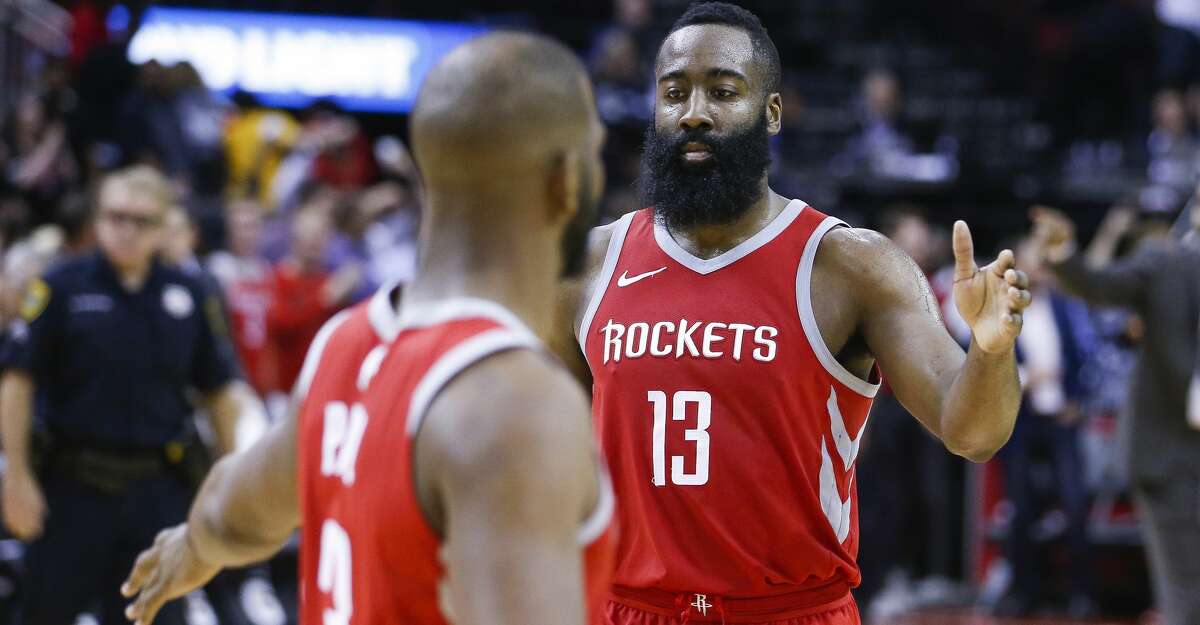 Houston Rockets guard James Harden (13) high fives guard Chris Paul (3) after Paul hit the game winning shot to beat the Portland Trail Blazers 96-94 at the Toyota Center Thursday, April 5, 2018 in Houston. (Michael Ciaglo / Houston Chronicle)
