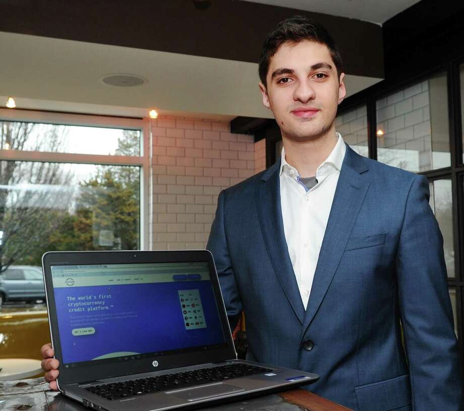 Marc Baghadjian with a computer showing the website of his company, Octium. Baghadjian, a 2017 graduate of the Brunswick School, is an entrepreneur. Photo: Bob Luckey Jr. / Hearst Connecticut Media / Greenwich Time