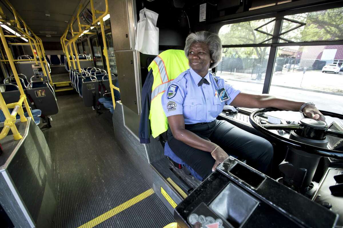 Bus driver Benita Johnson parks at a layover spot on April 4 in downtown Houston. Johnson, a 20-year veteran Metro bus operator and trainer, is drawing acclaim for her treatment of a woman on Easter Sunday.
