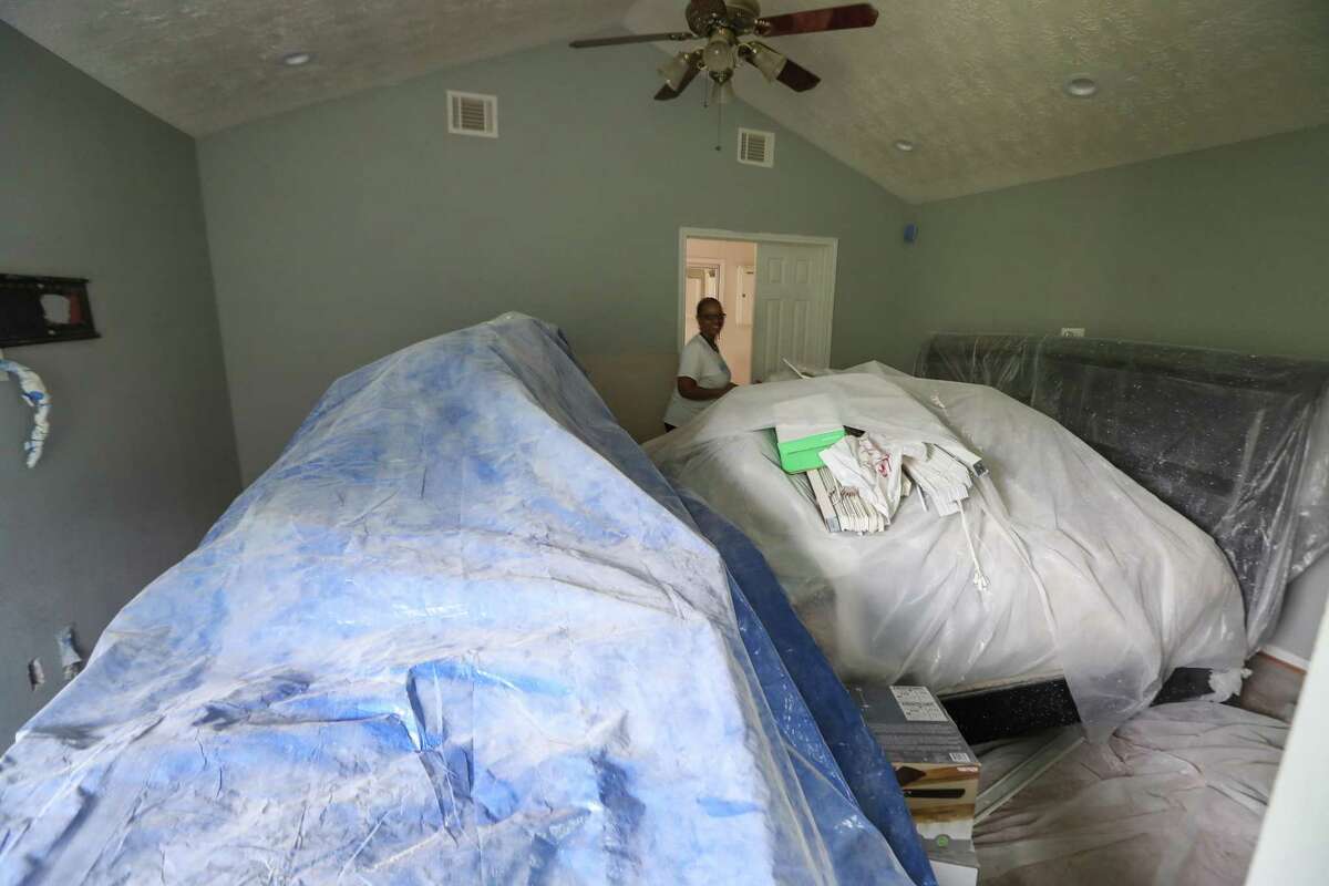 Carolyn Brown walks around her bedroom furniture, Thursday, April 5, 2018, in Houston. Her husband, Tyrone, is being treated for cancer are now relying on tens of thousands of dollars in low-interest loans to repair their home that was destroyed by Hurricane Harvey. ( Steve Gonzales / Houston Chronicle )