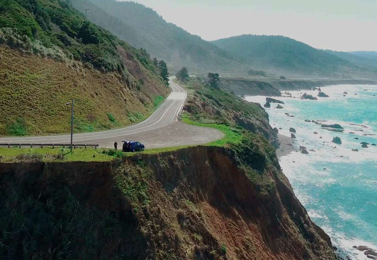 In this March 28, 2018 aerial file image from Alameda County Sheriff's Office drone video courtesy of Mendocino County shows the pullout where the SUV of Jennifer and Sarah Hart was recovered off the off Pacific Coast Highway 1, near Westport, Calif. The SUV carrying the large, free-spirited family from Washington state accelerated straight off the scenic California cliff and the deadly wreck may have been intentional, authorities said Sunday, April 1, 2018. (Alameda County Sheriff's Office via AP, File)