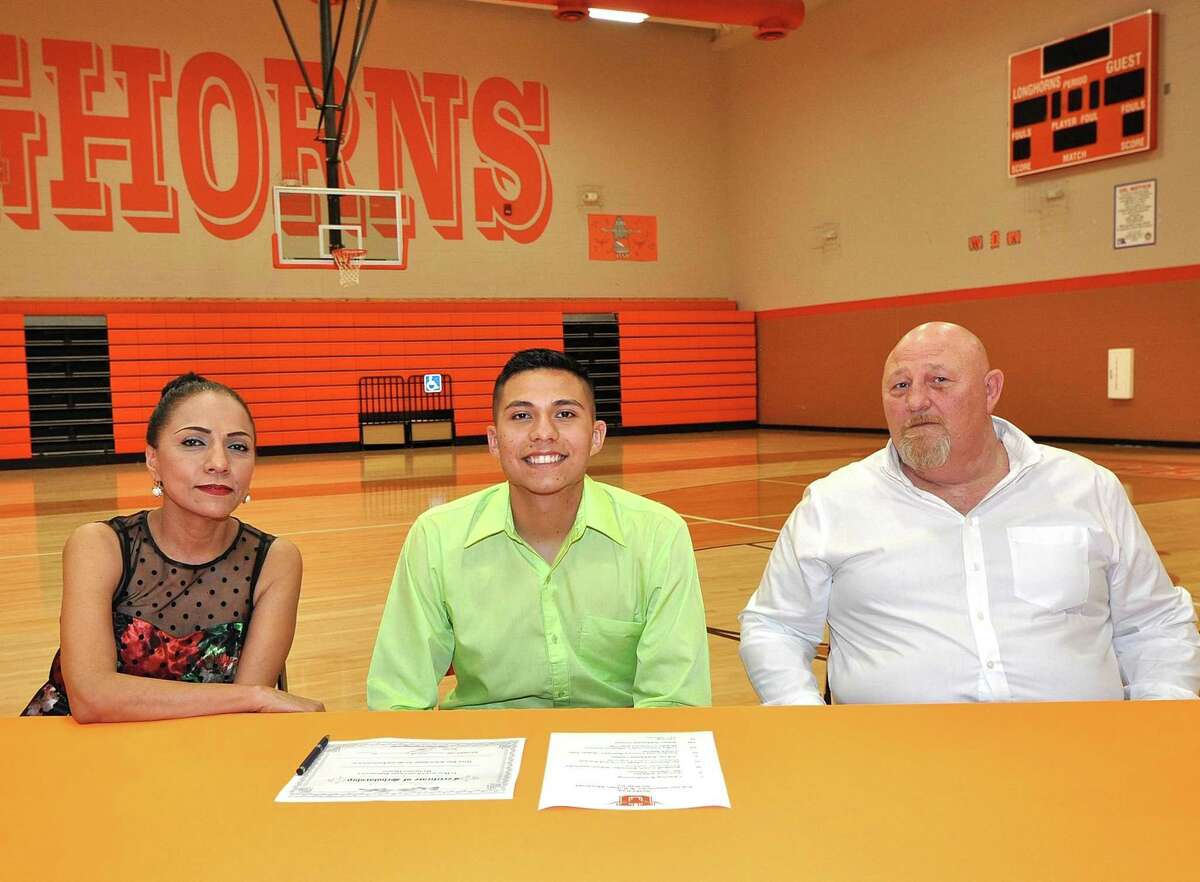Alongside his parents Nancy and Jimmy Dean, Ruben Martinez signed his NLI on Friday to run cross country at Colby Community College.
