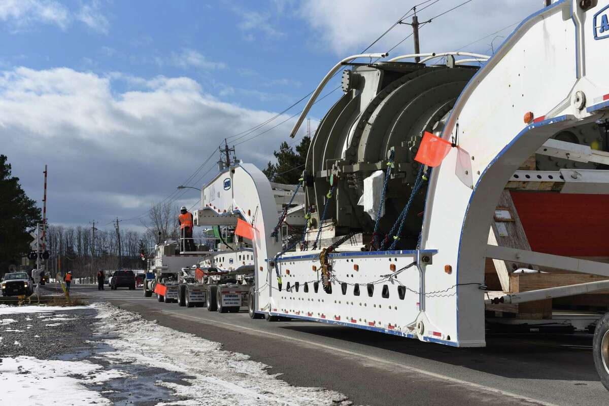 A 450-ton General Electric turbine is transported on Burdeck St. (Route 337) on Friday, Jan. 27, 2017, in Rotterdam, N.Y. According to GE, the unit is the first of its kind to be built in Schenectady and the largest ever to be shipped fully assembled by truck. (Will Waldron / Times Union)