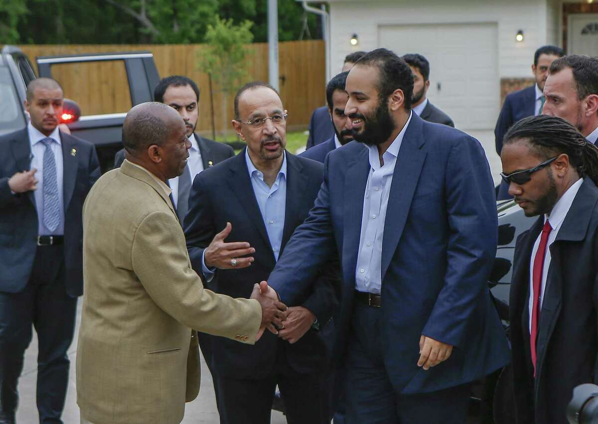 Khalid al-Falih, energy minister (center), introduces The Saudi Crown Prince, His Royal Highness Crown Prince Mohammed bin Salman (right) to Houston Mayor Sylvester Turner at a habitat for humanity home Saturday, April 7, 2018, in Houston. His Royal Highness Crown Prince Mohammed bin Salman visited a habitat for humanity home that aided Harvey victims and was supported by donations by the Aramco, the Saudi oil company. ( Steve Gonzales / Houston Chronicle )