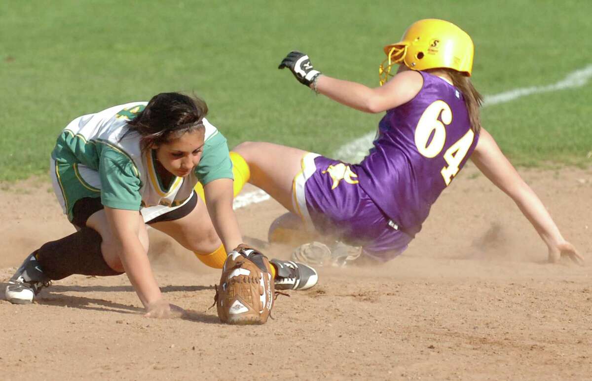 Westhill's Cassandra Kish slides safely into third as Trinity's Krissy Schule covers the base during the Vikings’ 4-0 win on April 8, 2010.