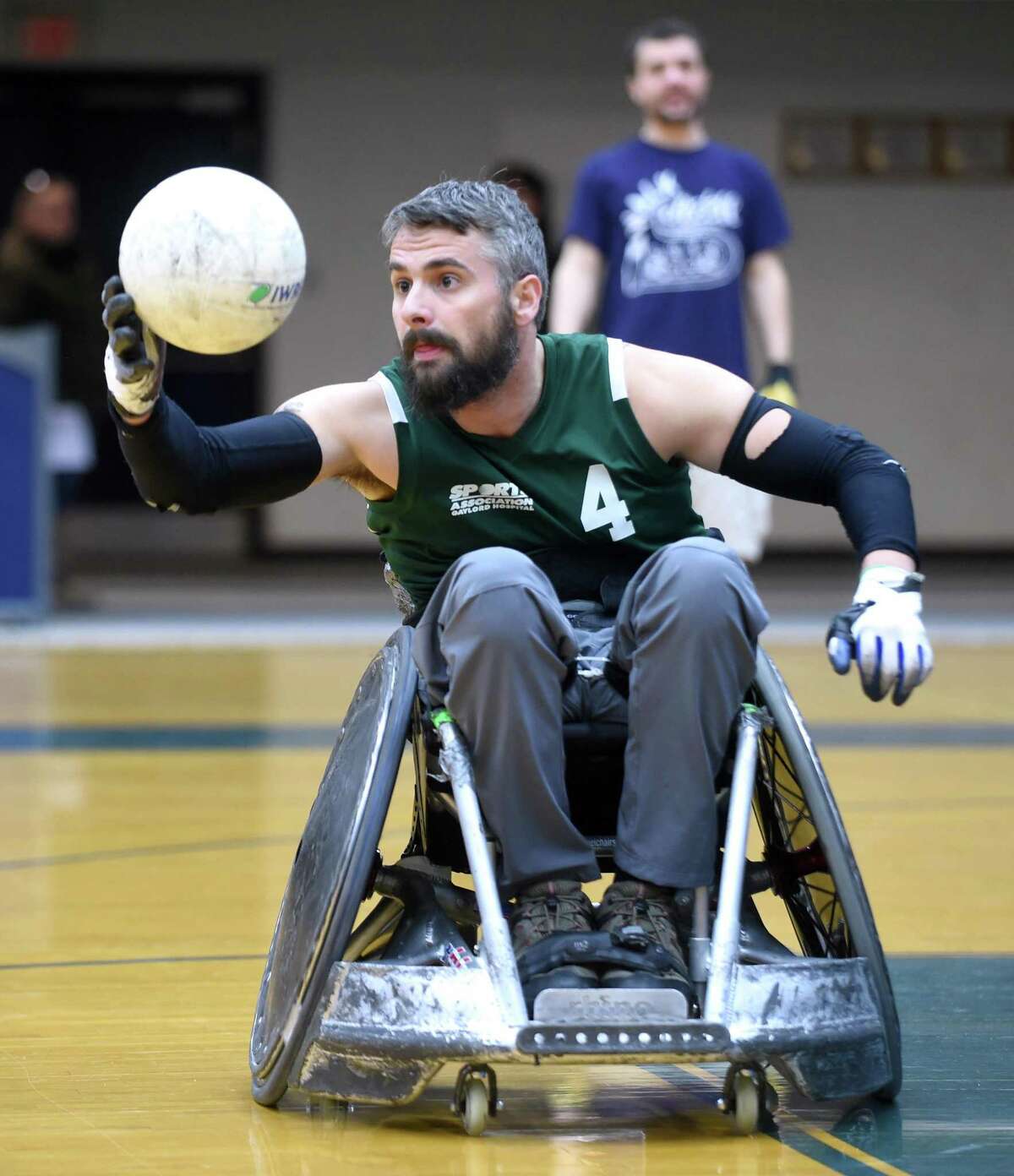 Brett Smith of the Connecticut Jammers Quad Rugby Team catches a pass during a wheelchair rugby demonstration and clinic at the Adaptive Sports Fest at Southern Connecticut State University’s Moore Field House in New Haven on Saturday.