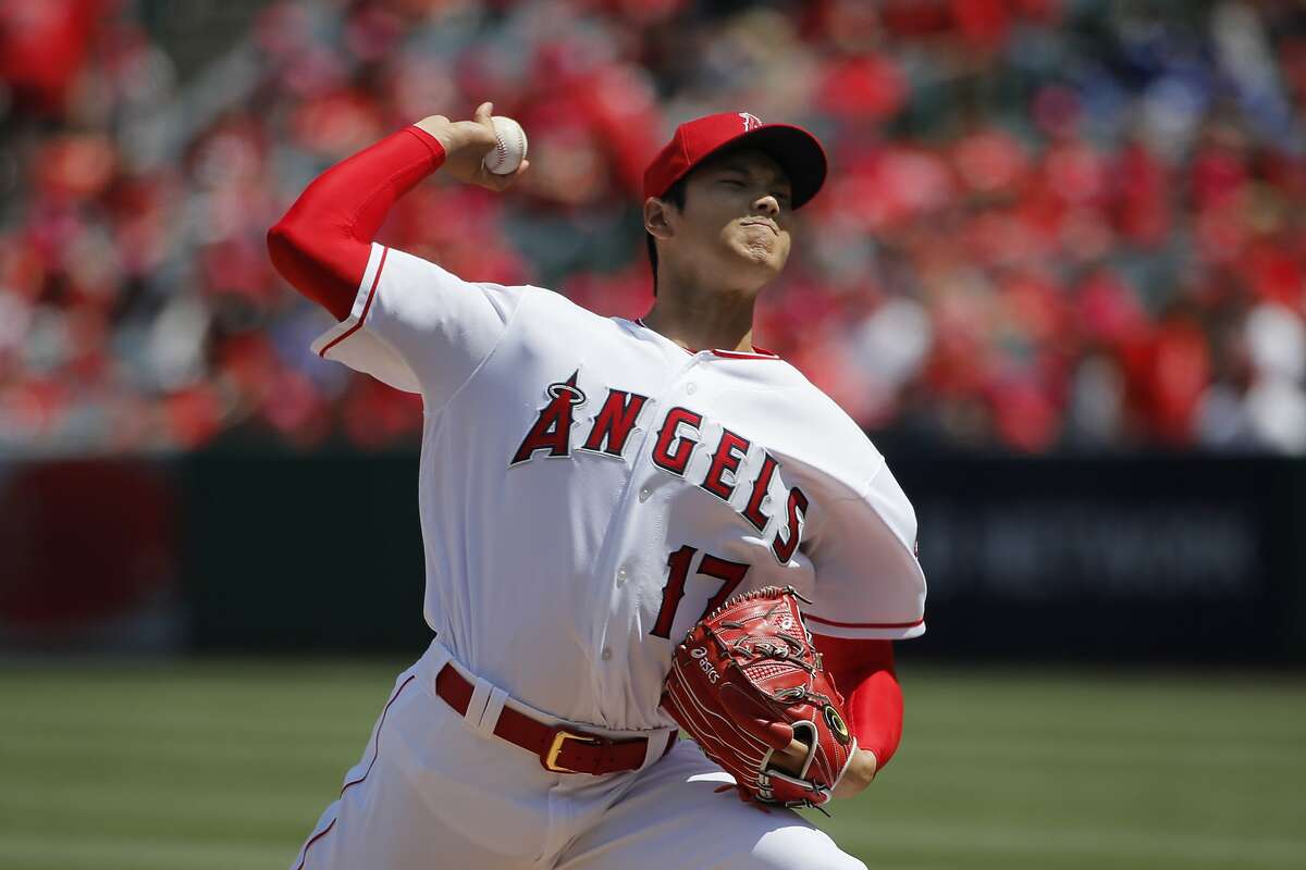 Los Angeles Angels starting pitcher Shohei Ohtani, of Japan, throws against the Oakland Athletics during the first inning of a baseball game, Sunday, April 8, 2018, in Anaheim, Calif. (AP Photo/Jae C. Hong)