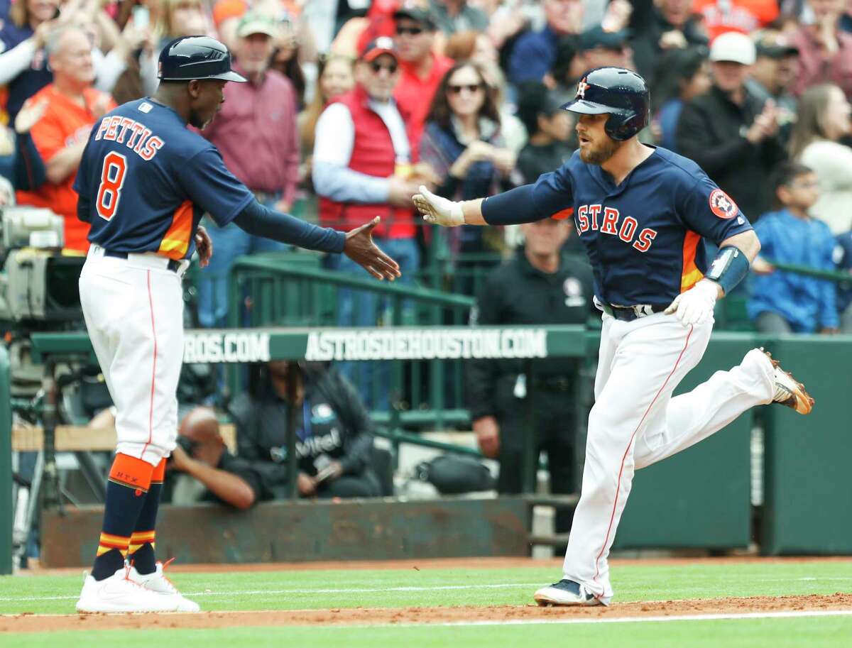 Houston Astros catcher Max Stassi (12) rounds third past third base coach Gary Pettis (8) after hitting a 3-run home run off of San Diego Padres starting pitcher Tyson Ross during the fifth inning of a major league baseball game at Minute Maid Park on Sunday, April 8, 2018, in Houston. ( Brett Coomer / Houston Chronicle )