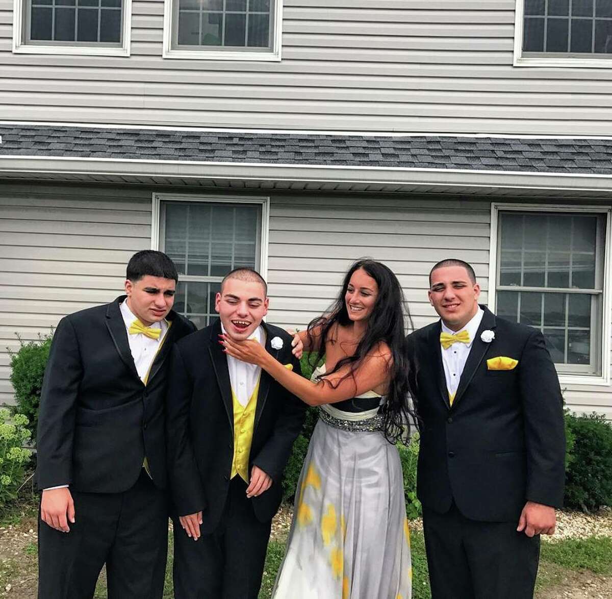 Ali Carbone and her three brothers, all of whom have autism.