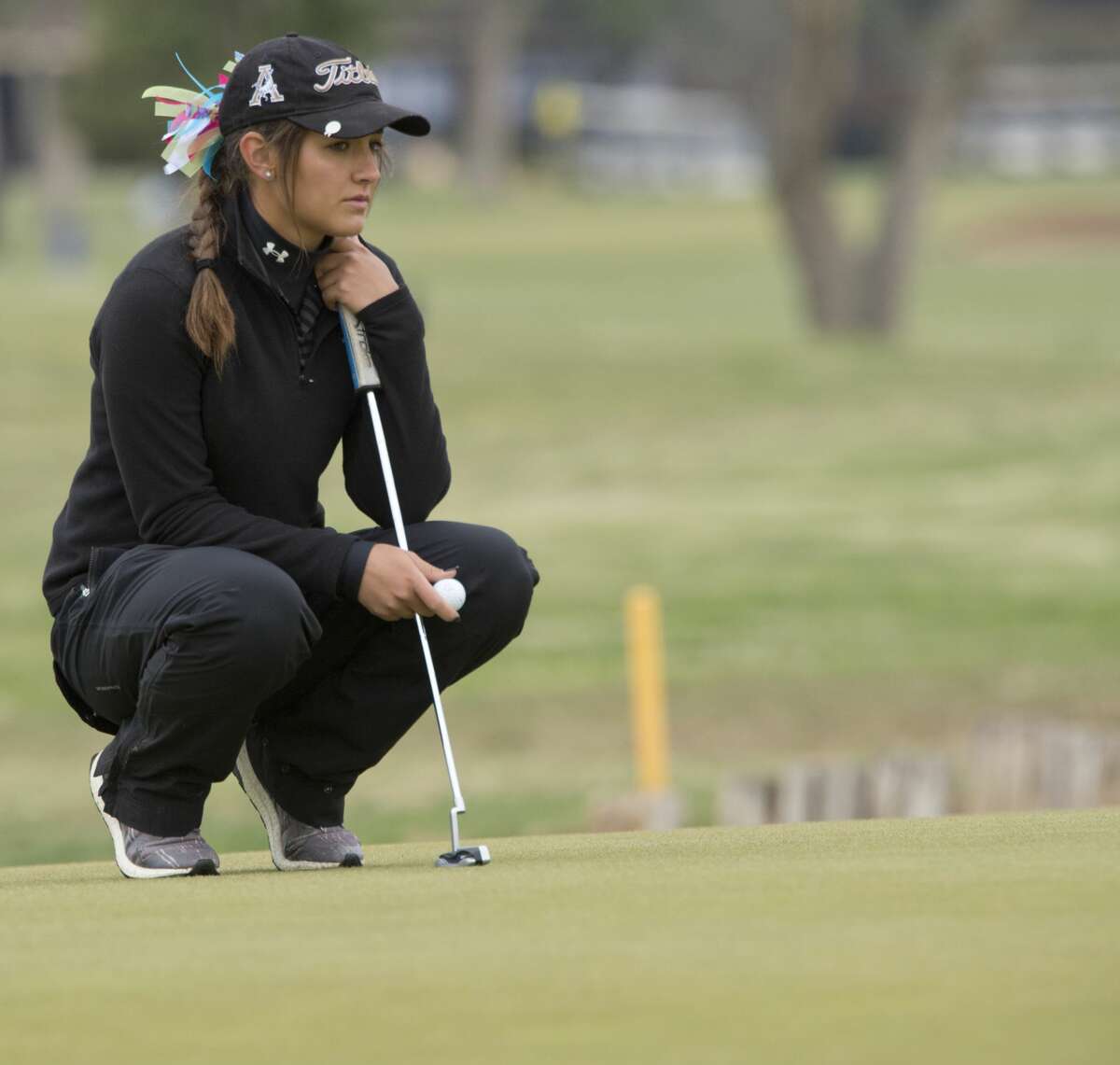 Andrews' Rachel Huffman looks at her line to putt 04/09/18 during District 4-4A golf at Ranchland Hills Golf Club. Tim Fischer/Reporter-Telegram