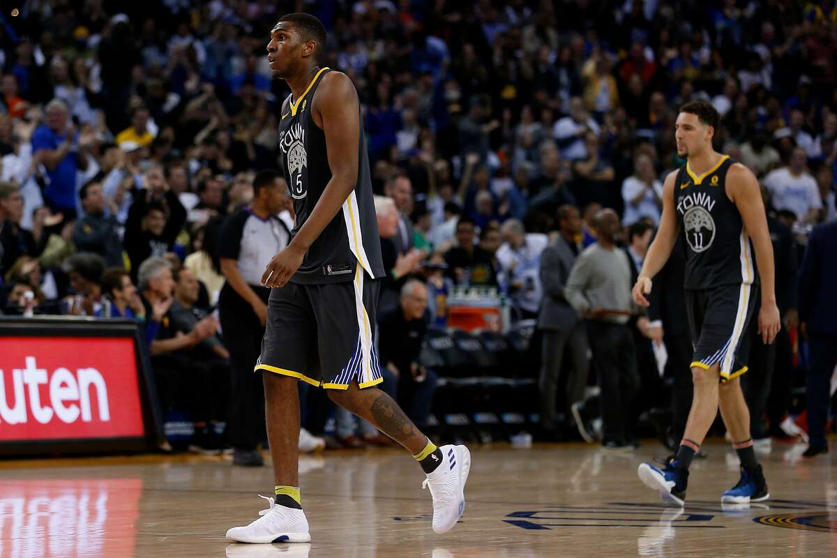 Golden State Warriors forward Kevon Looney (5) and guard Klay Thompson (11) during an NBA game between the Warriors and New Orleans Pelicans at Oracle Arena on Saturday, April 7, 2018, in Oakland, Calif. The Warriors lost 126-120.