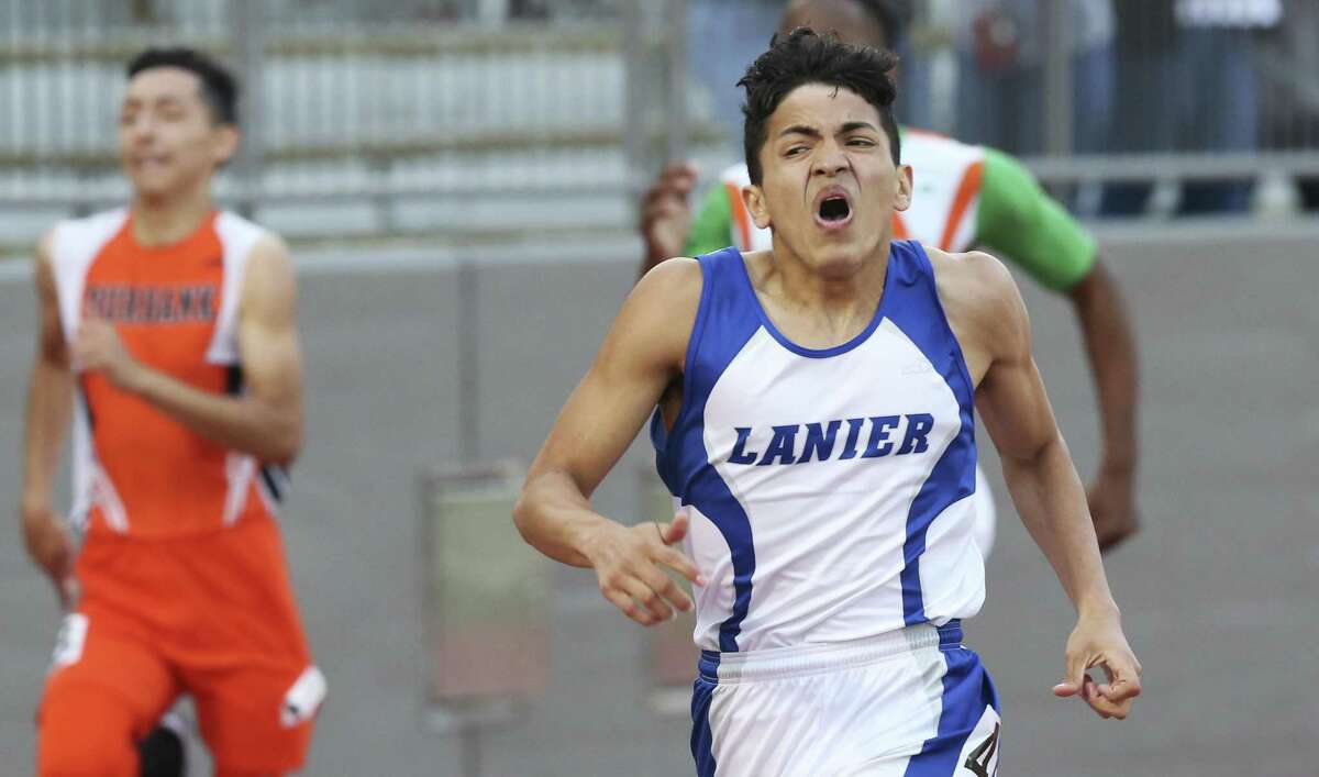 Jesse Hernandez strains near the finish line but wins the 400 meter race for Lanier during District 28-5A track and field meet at Alamo Stadium on April 5, 2018.