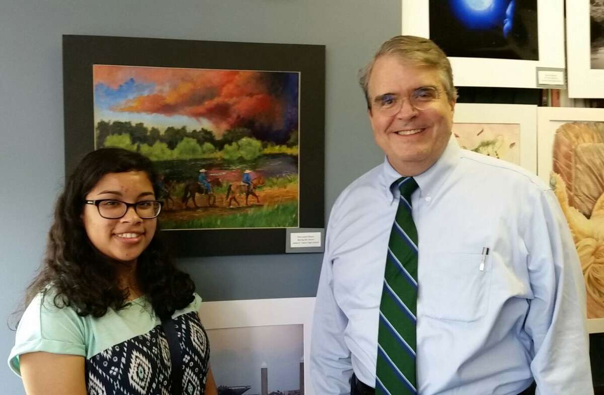 Taylor High School art student Ana Olvera has won the Congressional Art Competition with her oil painting Â?“Chasing the Storm.Â?” With Ana is District 7 U.S. Rep. John Culberson, R-West Houston.
